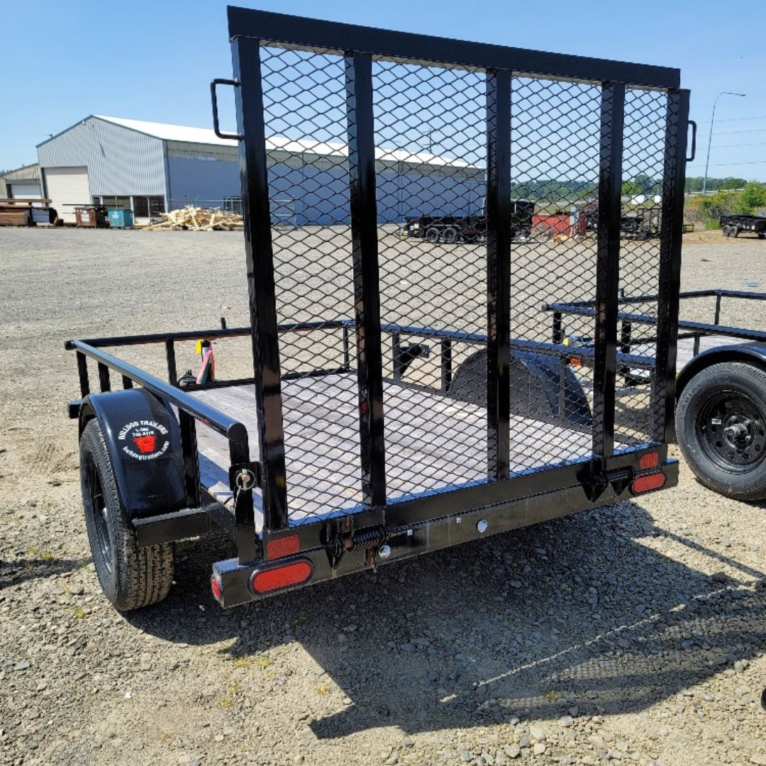 Black Big Tex 30SA utility trailer with rear mesh ramp gate